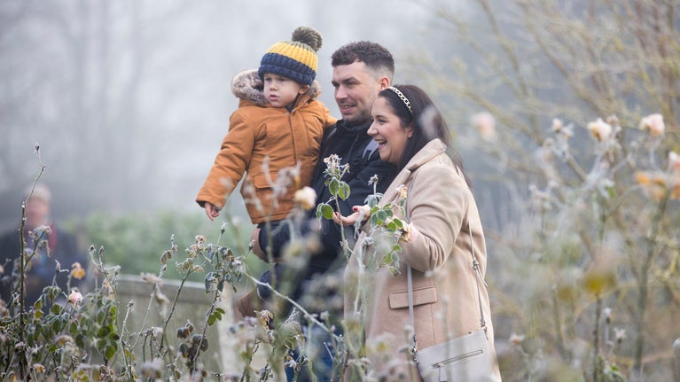 A family exploring the gardens at Christmas at Hinton Ampner, Hampshire